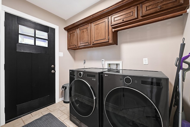 2003 Hidden Creek Dr, Houston, TX 77339 - washroom with washer and dryer, baseboards, and cabinet space
