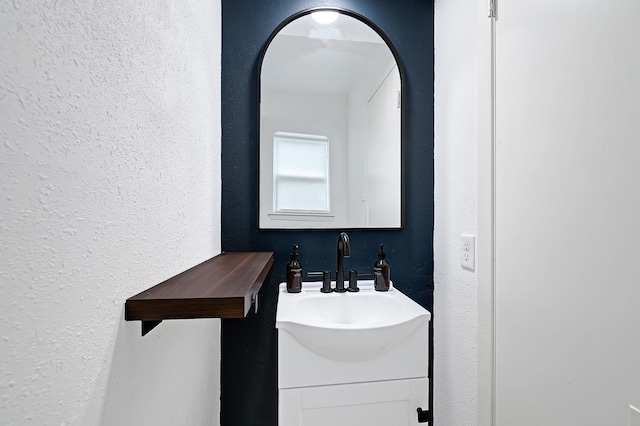 2003 Hidden Creek Dr, Houston, TX 77339 - bathroom with a textured wall and vanity