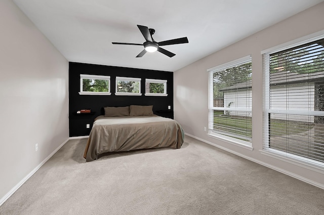 2003 Hidden Creek Dr, Houston, TX 77339 - carpeted bedroom featuring baseboards and a ceiling fan