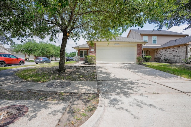 12903 Belmont Legend Ct, Houston, TX 77047 - traditional-style home with brick siding, a garage, and concrete driveway