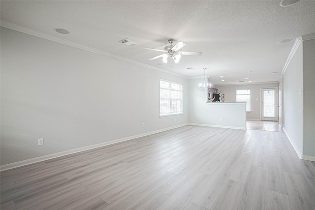 12903 Belmont Legend Ct, Houston, TX 77047 - unfurnished living room featuring crown molding, a ceiling fan, baseboards, light wood-style flooring, and a chandelier