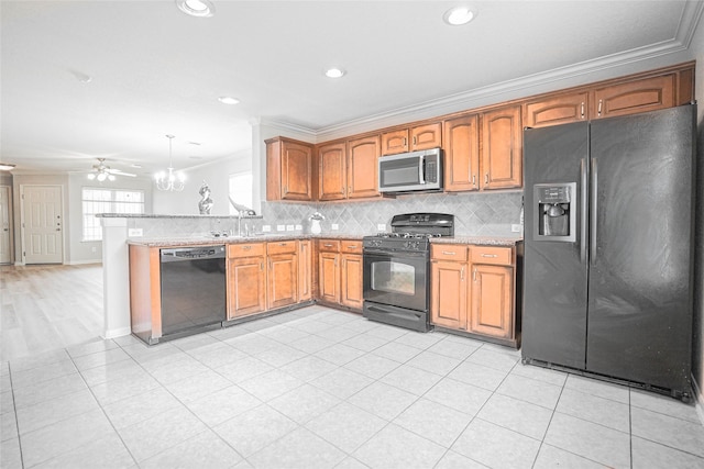 12903 Belmont Legend Ct, Houston, TX 77047 - kitchen with black appliances, ornamental molding, tasteful backsplash, a ceiling fan, and brown cabinetry