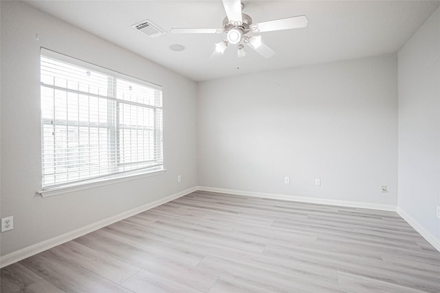 12903 Belmont Legend Ct, Houston, TX 77047 - unfurnished room with ceiling fan, light wood finished floors, and baseboards