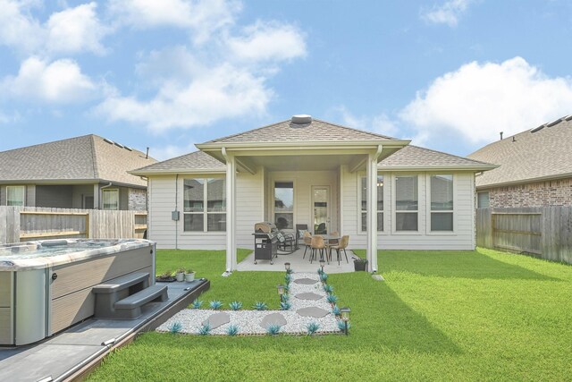 2104 Terra Rose Dr, Katy, TX 77493 - back of house featuring a hot tub and a patio