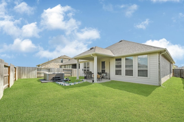 2104 Terra Rose Dr, Katy, TX 77493 - rear view of property with a hot tub, a patio, and a shingled roof