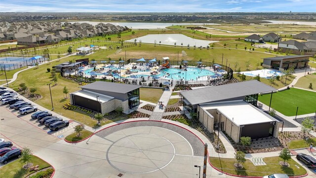 2104 Terra Rose Dr, Katy, TX 77493 - aerial view of residential area with a nearby body of water and a pool area