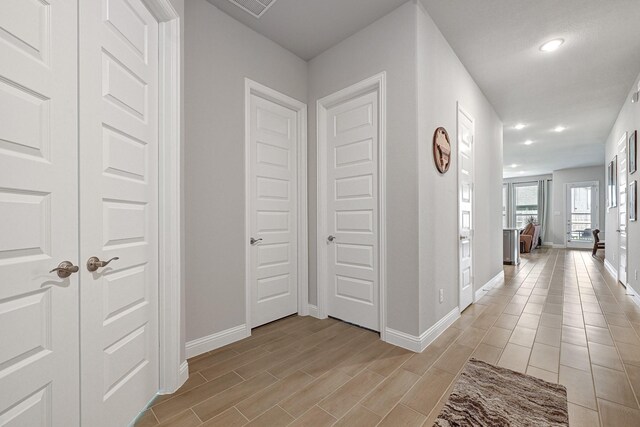 2104 Terra Rose Dr, Katy, TX 77493 - hallway featuring baseboards, recessed lighting, and light wood-type flooring
