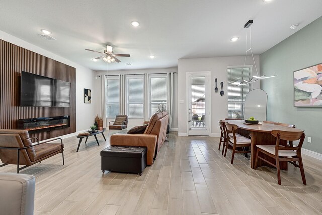2104 Terra Rose Dr, Katy, TX 77493 - living room with ceiling fan, baseboards, light wood-style flooring, and recessed lighting