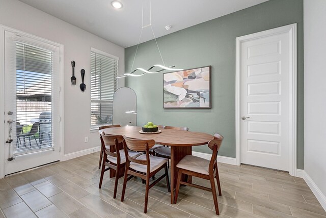 2104 Terra Rose Dr, Katy, TX 77493 - dining area with baseboards, wood finish floors, and recessed lighting