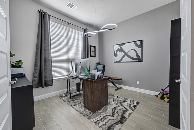 2104 Terra Rose Dr, Katy, TX 77493 - office with plenty of natural light, baseboards, and wood finish floors