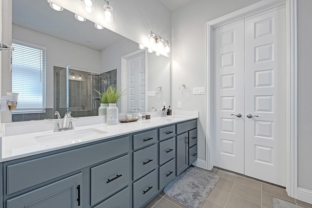 2104 Terra Rose Dr, Katy, TX 77493 - bathroom featuring double vanity, a shower stall, and tile patterned flooring