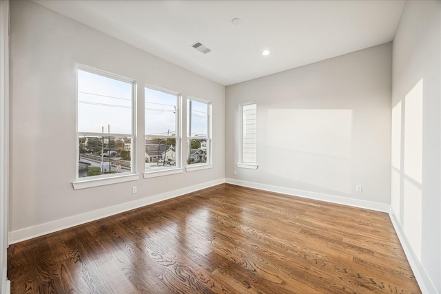 1518 Houston Ave, Houston, TX 77007 - empty room with plenty of natural light, wood finished floors, baseboards, and recessed lighting