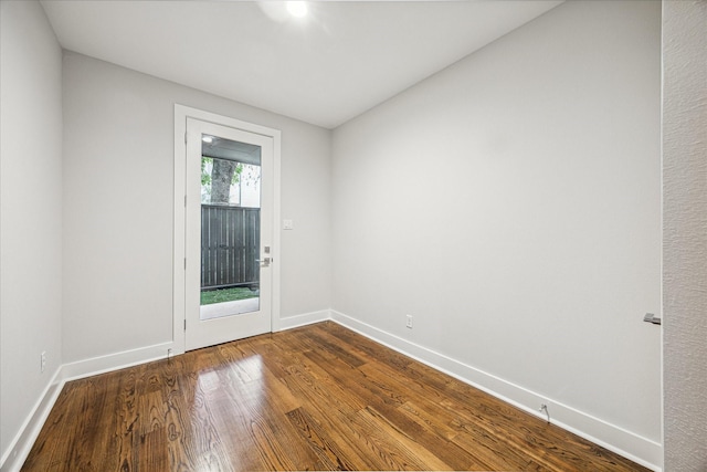 1518 Houston Ave, Houston, TX 77007 - unfurnished room with dark wood-style floors and baseboards