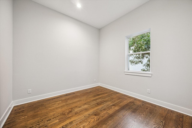 1518 Houston Ave, Houston, TX 77007 - empty room featuring baseboards and dark wood-style floors