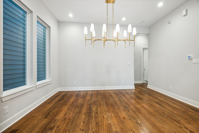 1518 Houston Ave, Houston, TX 77007 - unfurnished dining area featuring wood finished floors, a chandelier, baseboards, and recessed lighting