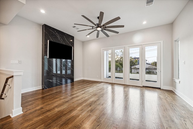1518 Houston Ave, Houston, TX 77007 - unfurnished living room with a ceiling fan, wood finished floors, baseboards, and recessed lighting