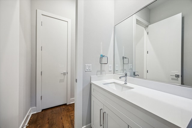1518 Houston Ave, Houston, TX 77007 - bathroom with wood finished floors, vanity, and baseboards