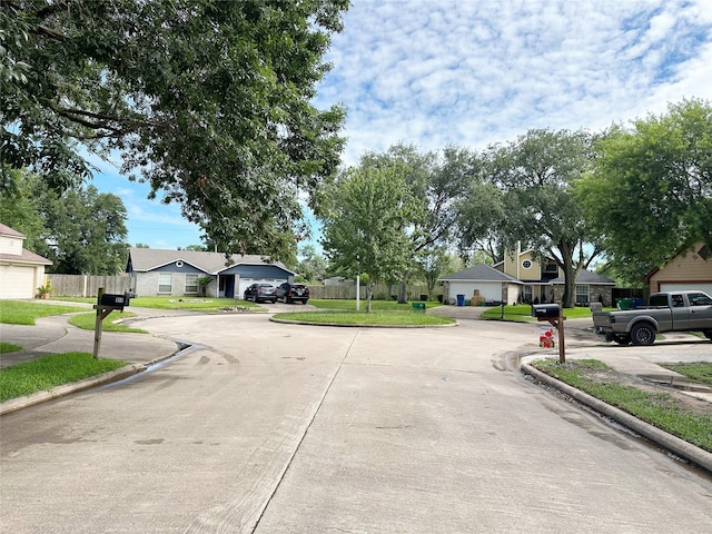 117 Lasso St, Angleton, TX 77515 - view of concrete street featuring curbs and a residential view