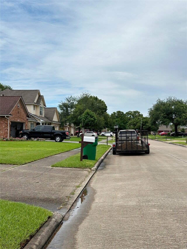117 Lasso St, Angleton, TX 77515 - view of concrete road with curbs