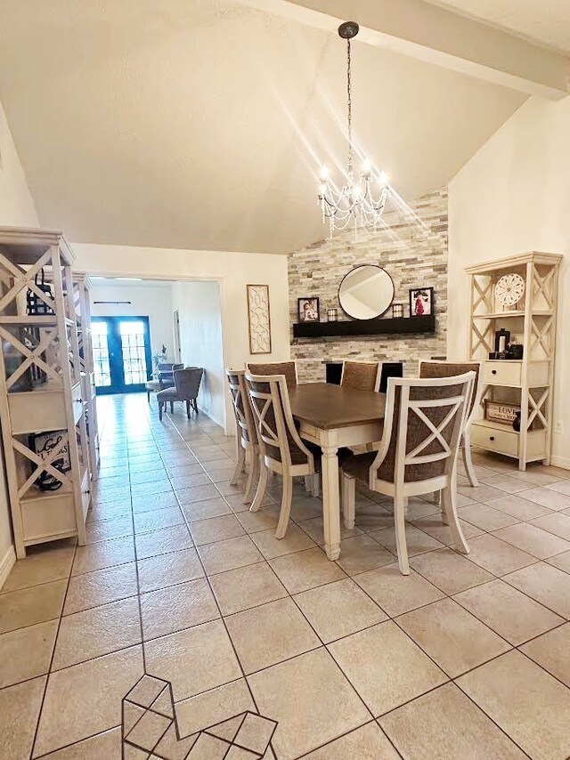 117 Lasso St, Angleton, TX 77515 - dining room with beamed ceiling, a chandelier, high vaulted ceiling, light tile patterned floors, and baseboards