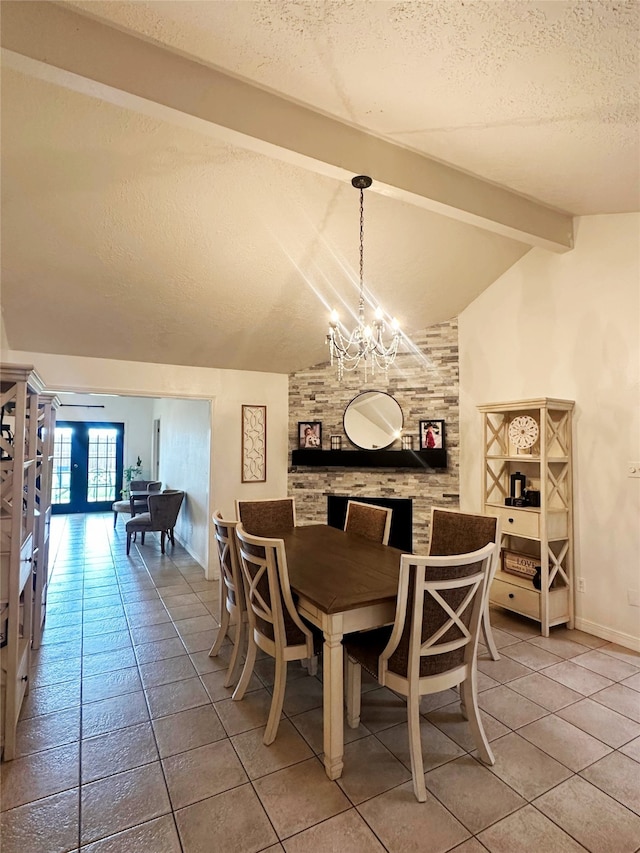117 Lasso St, Angleton, TX 77515 - tiled dining room featuring a textured ceiling, a chandelier, and baseboards
