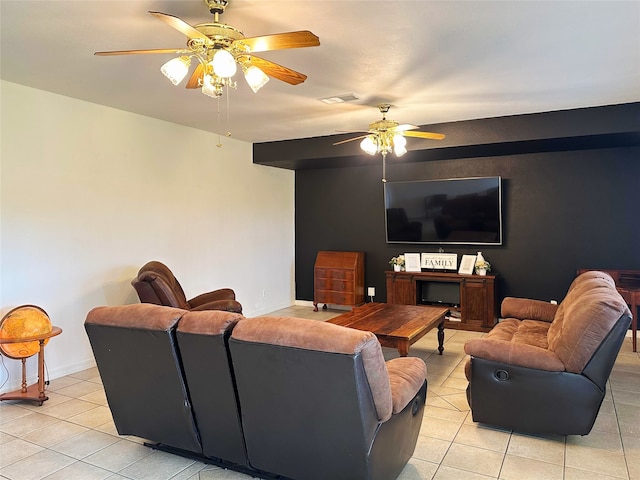117 Lasso St, Angleton, TX 77515 - living room featuring light tile patterned floors, a ceiling fan, and baseboards