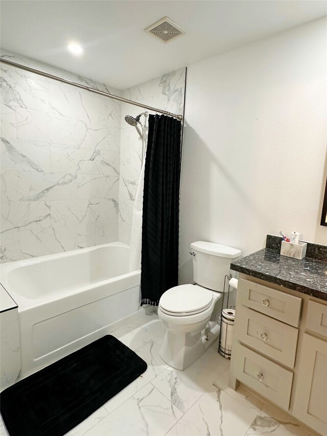 117 Lasso St, Angleton, TX 77515 - bathroom featuring marble look tile flooring, toilet, vanity, and shower / bath combo with shower curtain