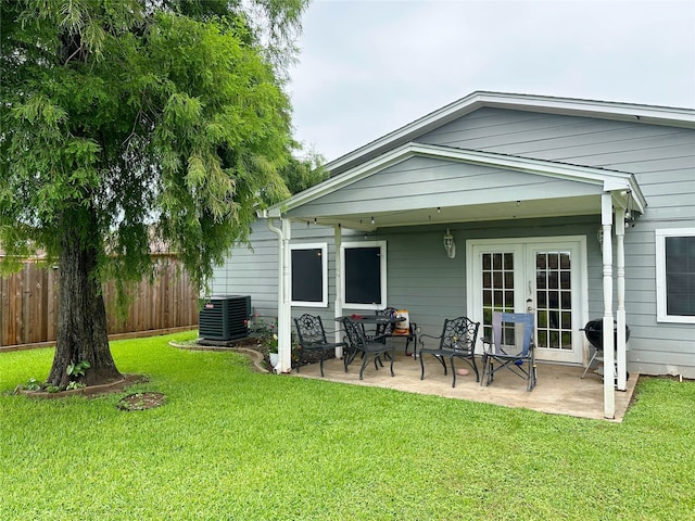 117 Lasso St, Angleton, TX 77515 - back of house featuring central AC, a patio area, and french doors