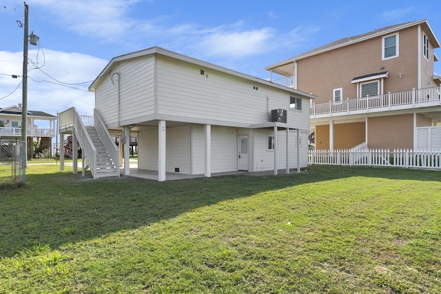 13014 John Reynolds Rd, Galveston, TX 77554 - back of property with stairway and a patio area