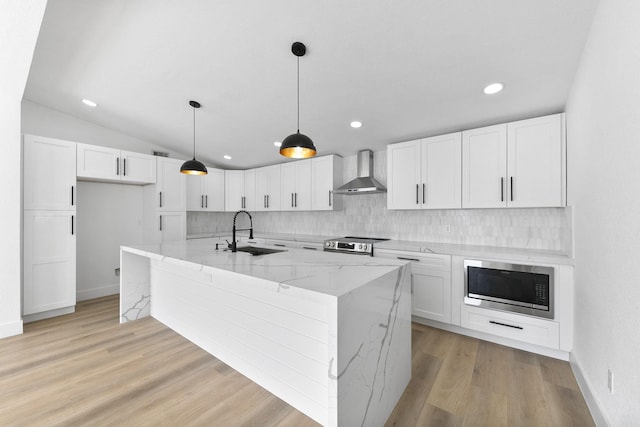 13014 John Reynolds Rd, Galveston, TX 77554 - kitchen with a sink, wall chimney range hood, built in microwave, white cabinets, and backsplash