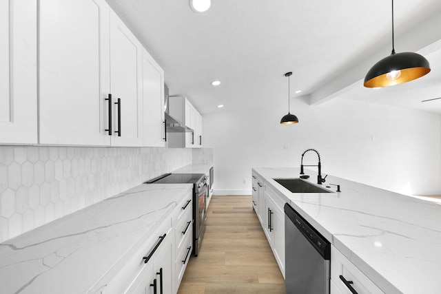 13014 John Reynolds Rd, Galveston, TX 77554 - kitchen featuring stainless steel appliances, a sink, white cabinetry, decorative backsplash, and recessed lighting