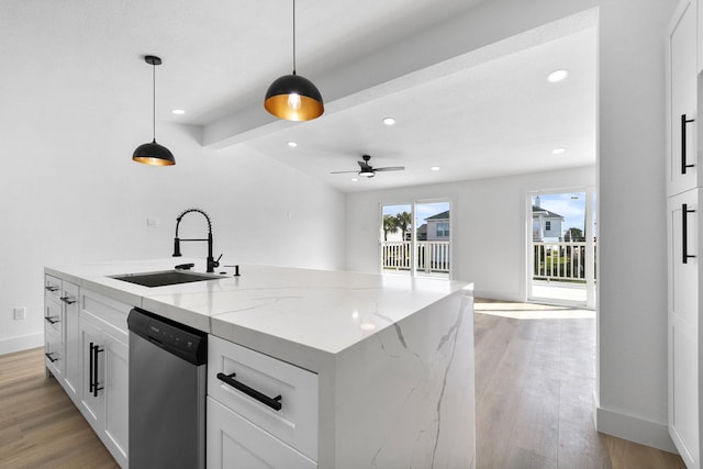 13014 John Reynolds Rd, Galveston, TX 77554 - kitchen with stainless steel dishwasher, a sink, light wood finished floors, baseboards, and ceiling fan