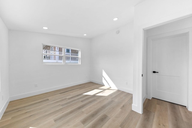 13014 John Reynolds Rd, Galveston, TX 77554 - unfurnished room with light wood-style flooring, baseboards, and recessed lighting