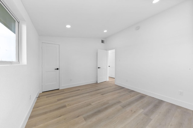 13014 John Reynolds Rd, Galveston, TX 77554 - spare room featuring recessed lighting, light wood-style floors, and baseboards