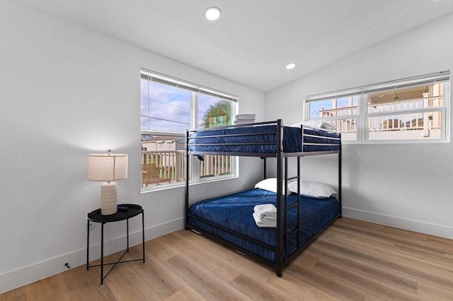 13014 John Reynolds Rd, Galveston, TX 77554 - bedroom with lofted ceiling, baseboards, wood finished floors, and recessed lighting