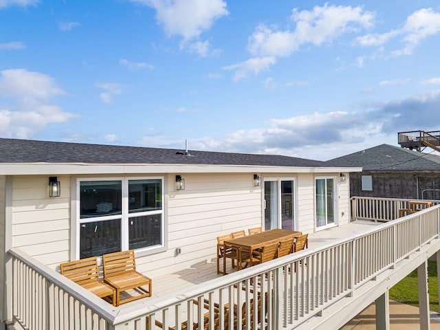 13014 John Reynolds Rd, Galveston, TX 77554 - wooden deck with outdoor dining space