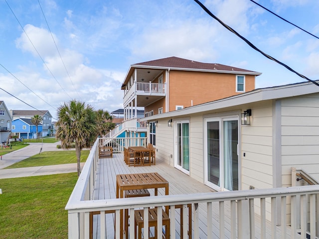 13014 John Reynolds Rd, Galveston, TX 77554 - deck featuring a residential view, a yard, and outdoor dining area
