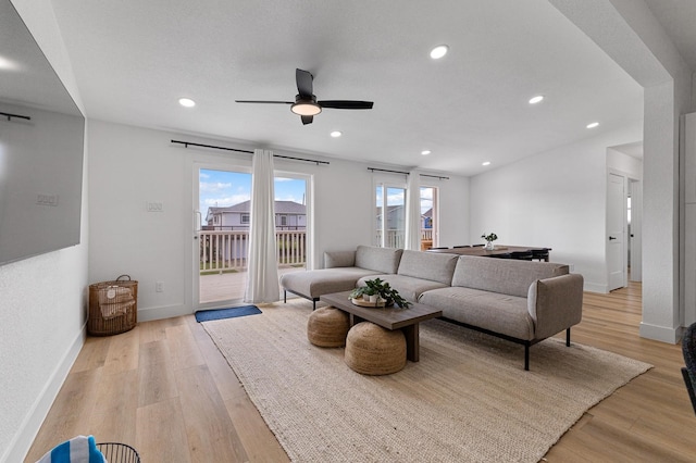 13014 John Reynolds Rd, Galveston, TX 77554 - living room featuring a ceiling fan, light wood-style flooring, baseboards, and recessed lighting