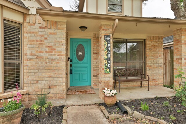 2310 Willow Bend Dr, Richmond, TX 77406 - entrance to property featuring brick siding and a porch