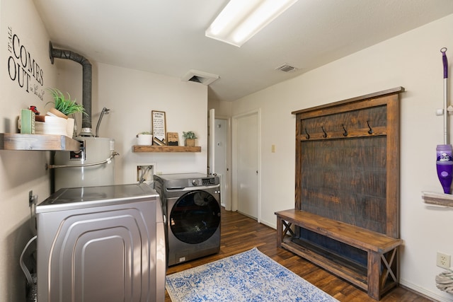 2310 Willow Bend Dr, Richmond, TX 77406 - laundry area featuring separate washer and dryer, dark wood-style flooring, and water heater
