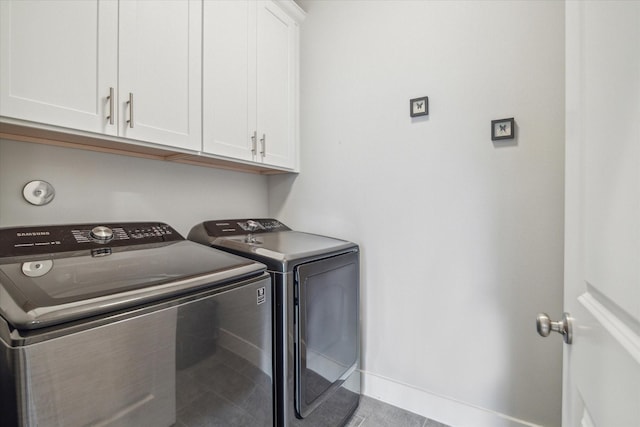 706 Olive St Unit B, Houston, TX 77007 - laundry area with washing machine and clothes dryer, cabinet space, tile patterned floors, and baseboards