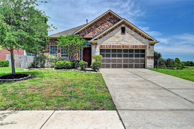 20610 Arrow Falls Ln, Richmond, TX 77407 - view of front facade featuring stone siding, a garage, and concrete driveway