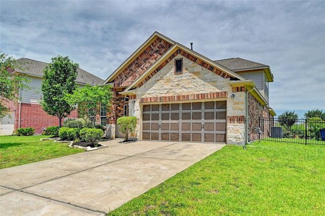 20610 Arrow Falls Ln, Richmond, TX 77407 - view of front of property featuring stone siding, a garage, driveway, and central AC unit