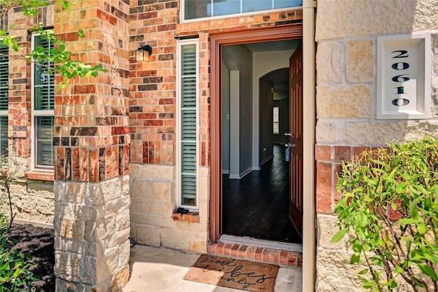 20610 Arrow Falls Ln, Richmond, TX 77407 - view of exterior entry featuring brick siding