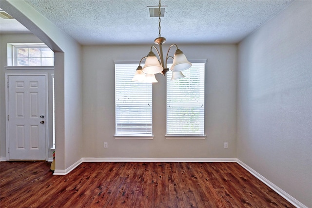 20610 Arrow Falls Ln, Richmond, TX 77407 - entryway with a chandelier, dark wood finished floors, baseboards, and a textured ceiling
