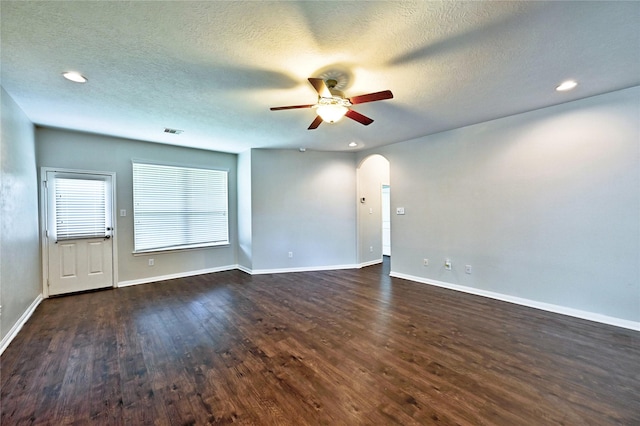 20610 Arrow Falls Ln, Richmond, TX 77407 - spare room featuring a ceiling fan, wood finished floors, arched walkways, a textured ceiling, and recessed lighting