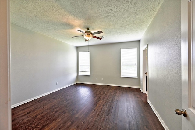 20610 Arrow Falls Ln, Richmond, TX 77407 - spare room with ceiling fan, dark wood-style flooring, baseboards, and a textured ceiling