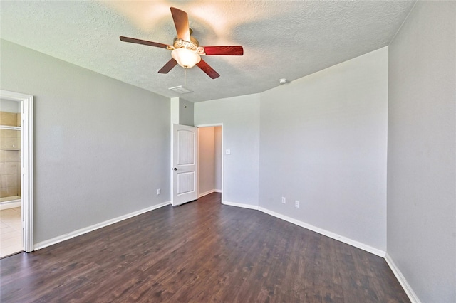 20610 Arrow Falls Ln, Richmond, TX 77407 - unfurnished bedroom with dark wood finished floors, a textured ceiling, baseboards, ensuite bathroom, and ceiling fan