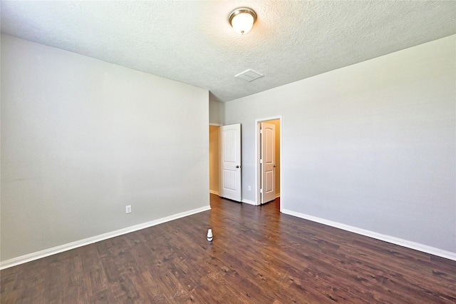 20610 Arrow Falls Ln, Richmond, TX 77407 - spare room with wood finished floors, baseboards, and a textured ceiling