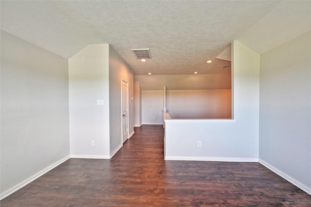 20610 Arrow Falls Ln, Richmond, TX 77407 - empty room featuring a textured ceiling, recessed lighting, wood finished floors, and baseboards